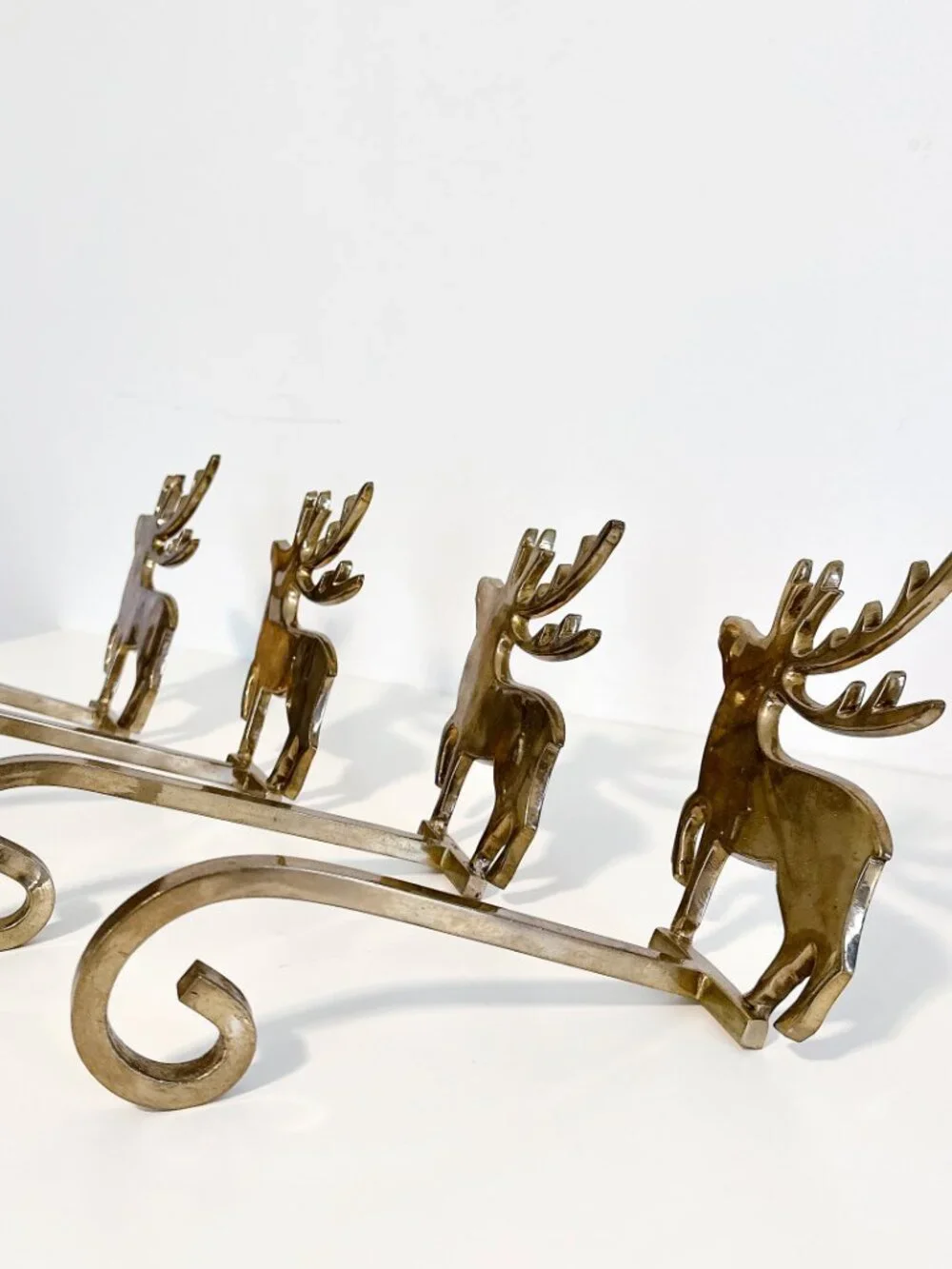 SET OF FOUR BRASS REINDEER MANTEL STOCKING HANGERS